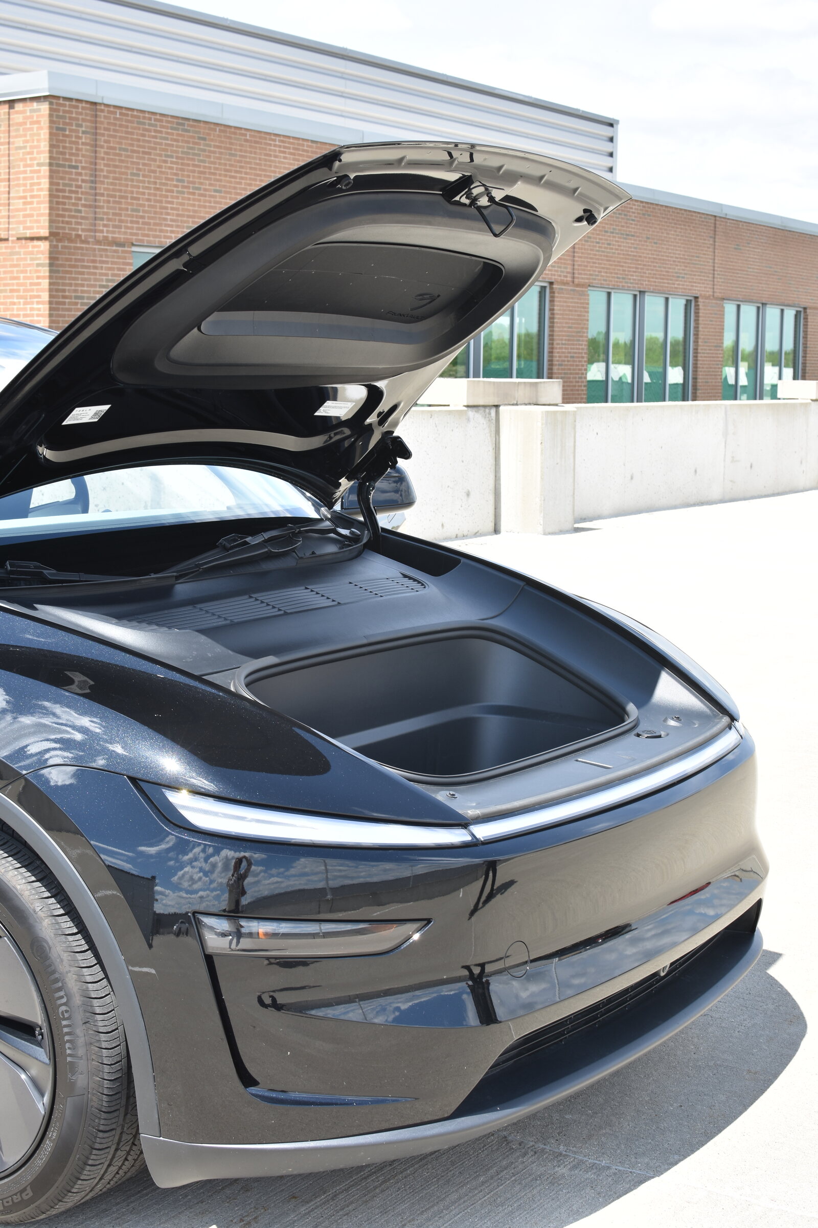 Finished FrunkVault installed against the underside of a Tesla Model Y Juniper hood